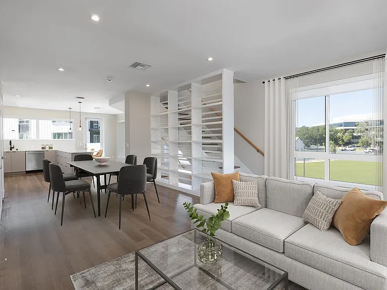 Signature Collection I 4-Bedroom Townhome Living and dining areas with built-in shelving
