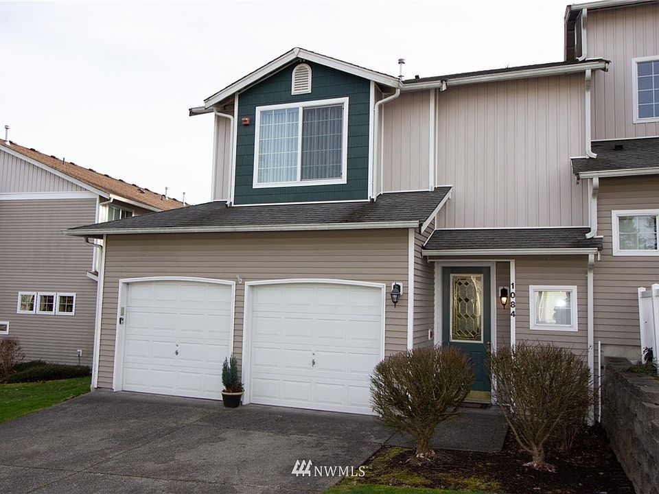 End Unit Townhome with oversized 2 car garage and 2 parking spaces outside 