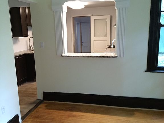 Dining room facing kitchen and laundy room beyond kitchen.