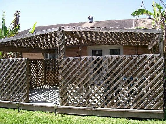 Enjoy Your New Spacious Yard With Covered Arbor!