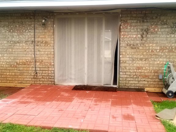 Sliding doors to fenced backyardpatio