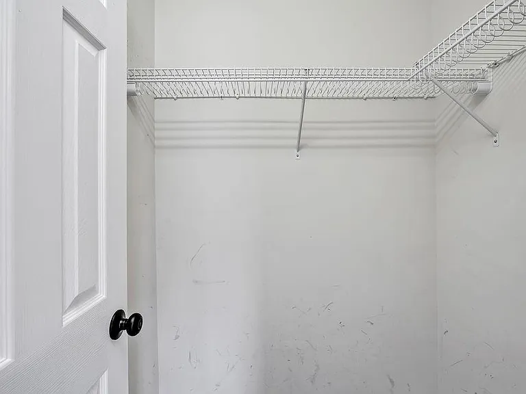 Small walk in closet attached to the guest bedroom #2. Access to the attic above.