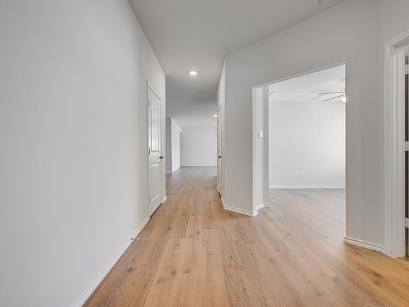 6077 Freedom - Entry Looking into Study - Full Bath to the Right