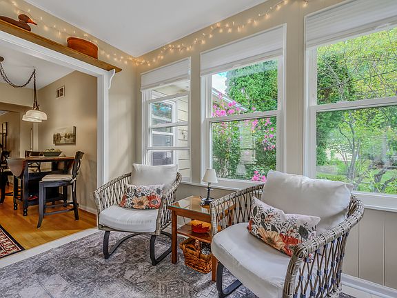 The sunroom flows seamlessly into the dining room and provides the perfect place to start the day.