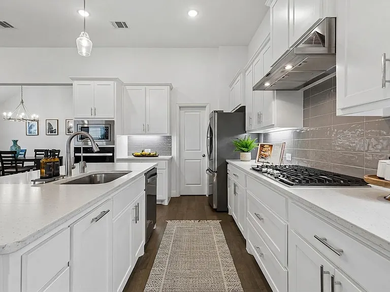 Easily store your pots and pans in the oversized drawers below the cooktop plus plenty of storage in the huge walk in pantry!