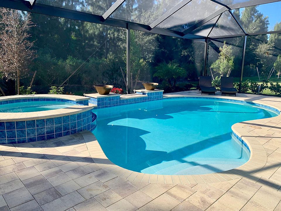 Custom salt water pool with hot tub and magic water bowls with cascading water and led lighting