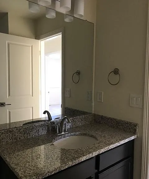 2nd bath on 2nd floor, nice wide cabinet and counter