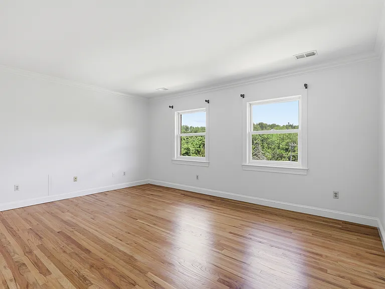 Upper level secondary bedroom with ensuite bath.