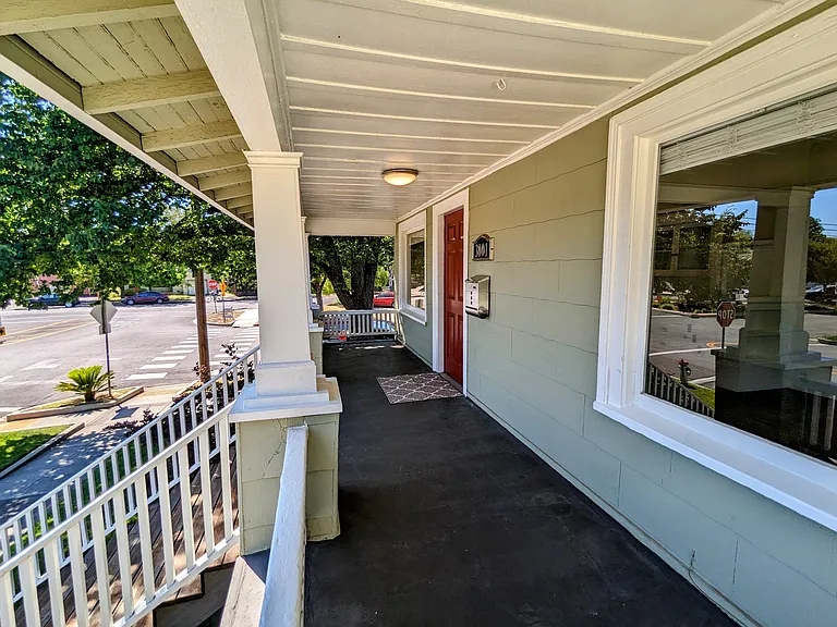 Enjoy morning coffee or evening cocktails on the wide front porch.
