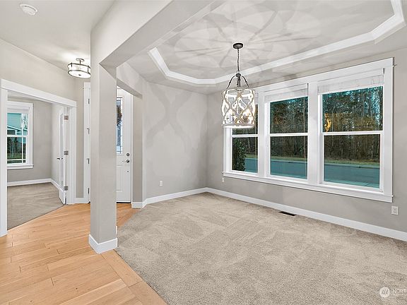 Lovely Formal Dining Areas with Decorative Coffered Ceiling & Chandelier>