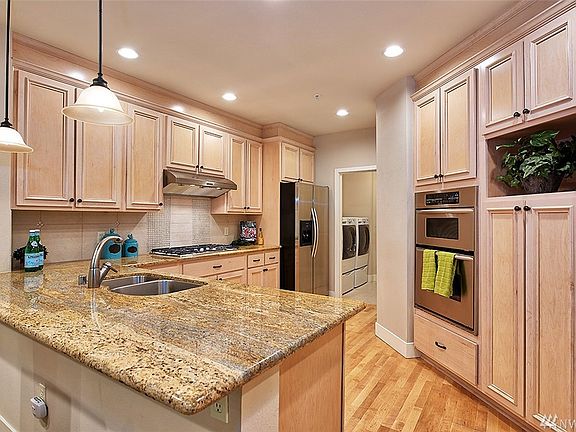 KitchenAid 5 burner cooktop. Looking out over Great Room and private green view.