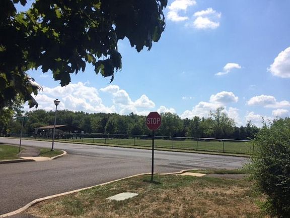 View across the street (park, pavilion, basketball, walking path)