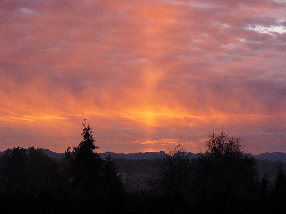 Sunrise over the mountains view from 4 rooms.