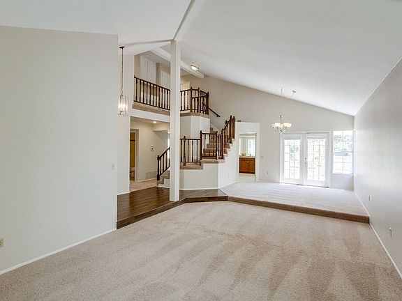 Large living room + dining area.  Down stairs bedroom #4 left of the stairs.