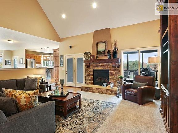 Great Room opens to Kitchen and Hearth & walks out to screened Lanai