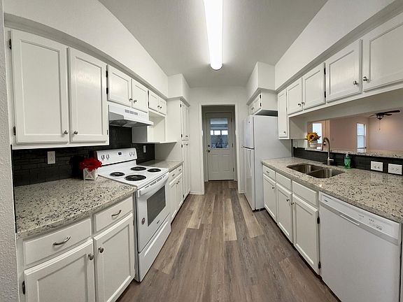 Kitchen with quartz countertops and new appliances