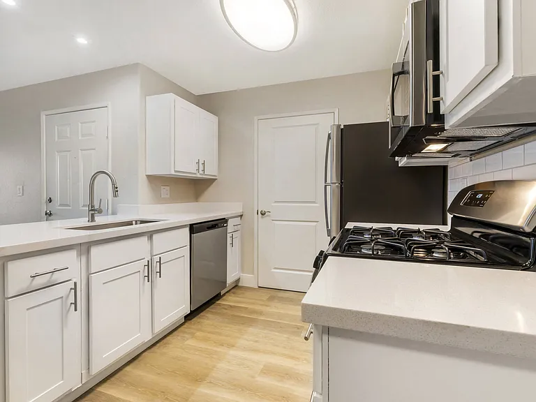 With ample counter space and stylish cabinetry, this kitchen is not only a chef's dream but also a warm, welcoming hub for your home.