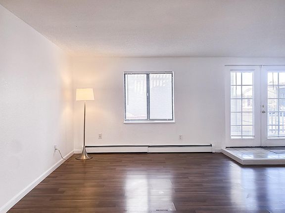 Living room and entry with laminate wood flooring.