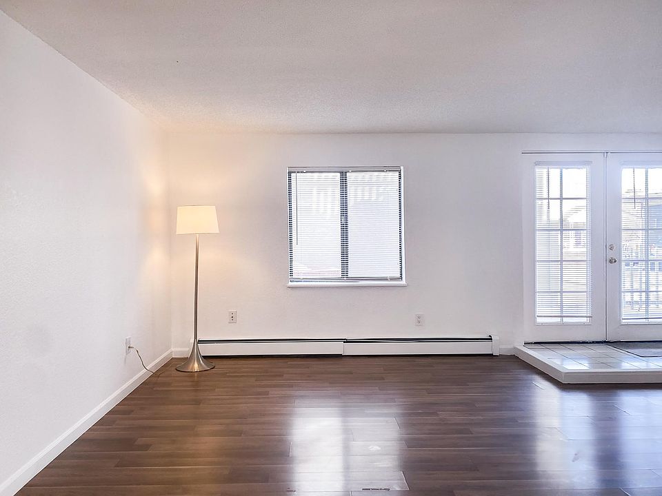 Living room and entry with laminate wood flooring.