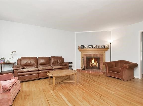 Living room with fireplace and hardwood floors