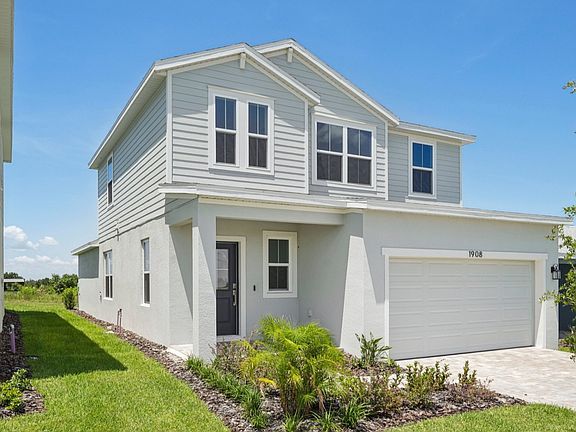 Jupiter Exterior Elevation in Hamilton Bluff by DRB Homes located in Haines City, FL.