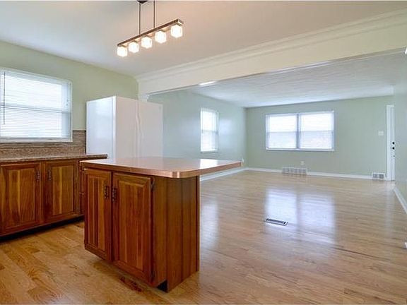 Kitchen opening to spacious living room