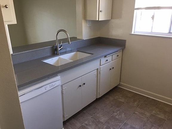 New kitchen counters, sink, and flooring