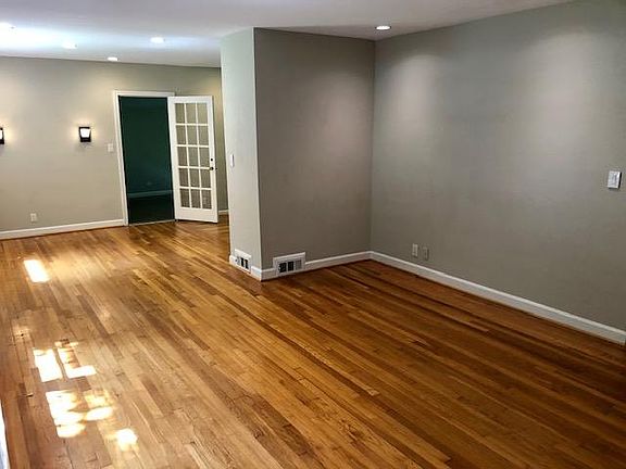 Large living are with hardwood floors and lots of natural light