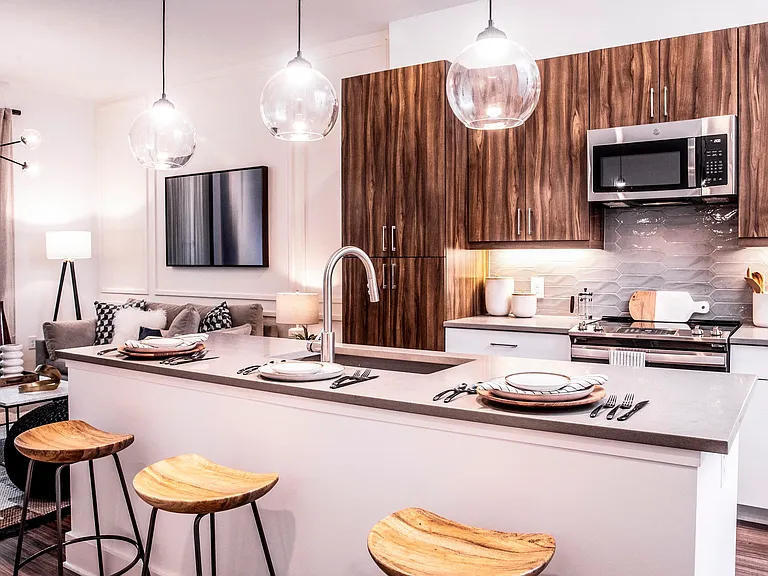 Kitchens are complete with an entertaining island and quartz countertops.