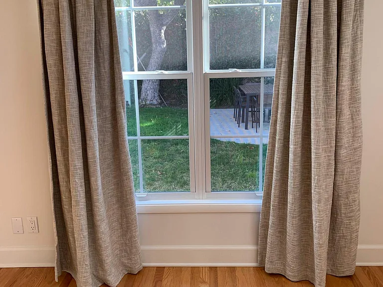 View of backyard (avocado tree) from primary bedroom