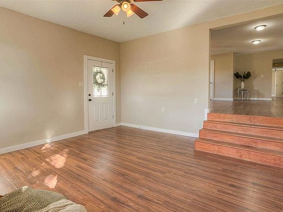 The entry flows into a large front living area.