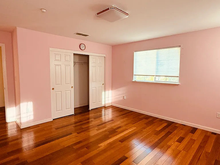 Upstairs bedroom with generous natural light