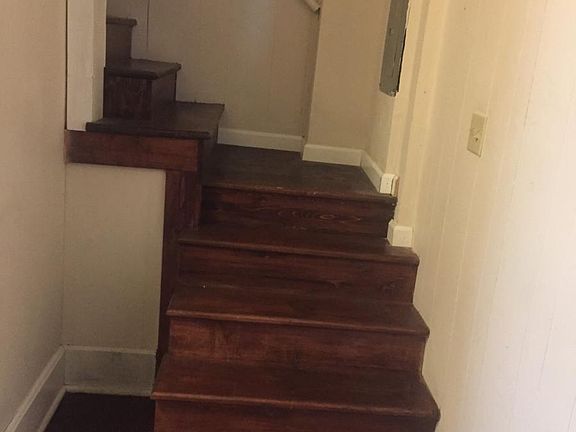 Stairway from outside of laundry area to upstairs.