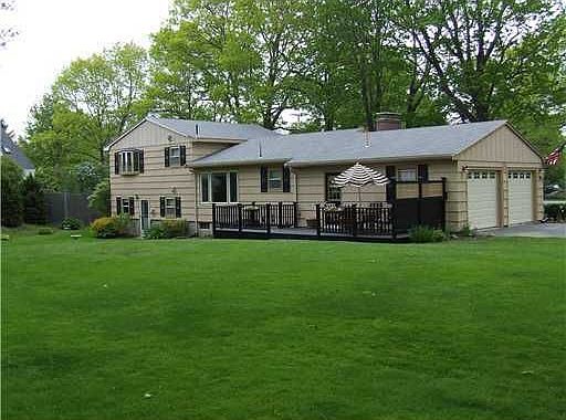 Back of house with deck