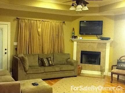 Living Area
						:
						The living area is spacious with tray celiings and opens into the kitchen.