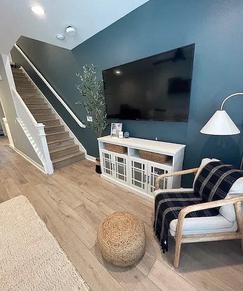 Large flat screen and extra seating for guests.