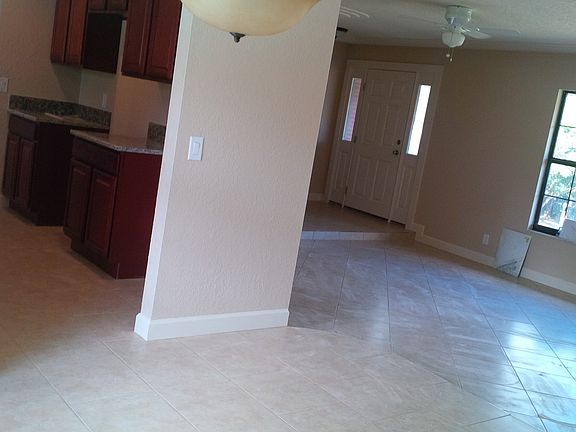View from dining room of kitchen and sunken living room