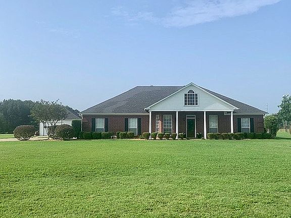 Front of house, shop on side