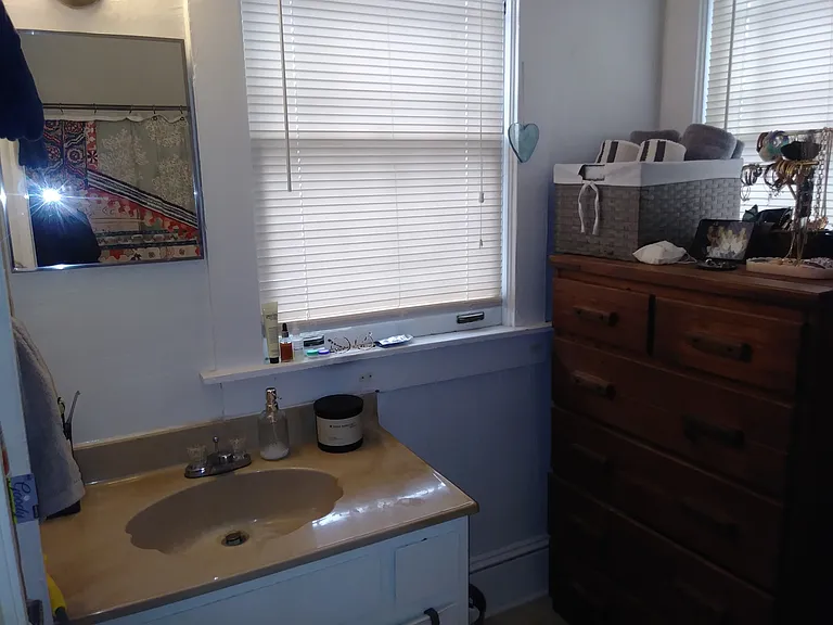 Bathroom accessorized by previous tenant.