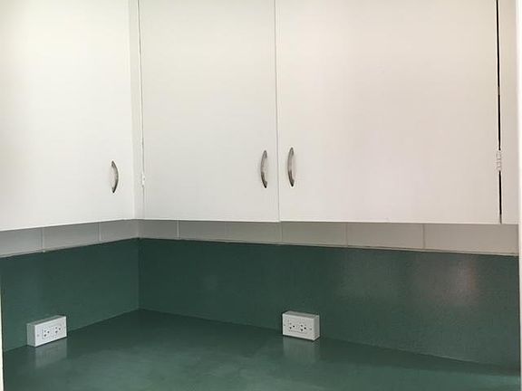 Ceiling high cabinets and pantry.