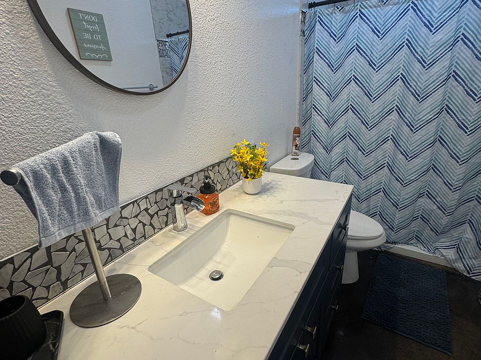 Bathroom with full counter. 
Full size Shower