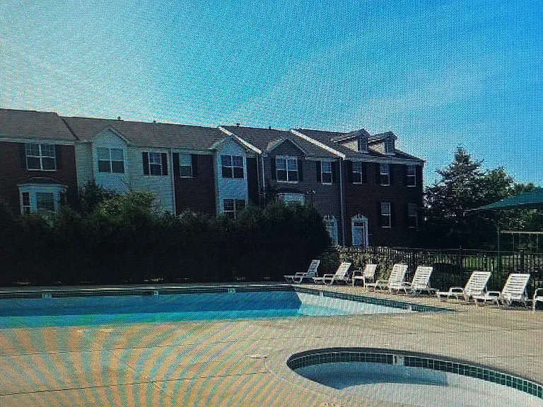 Outdoor community pool in complex