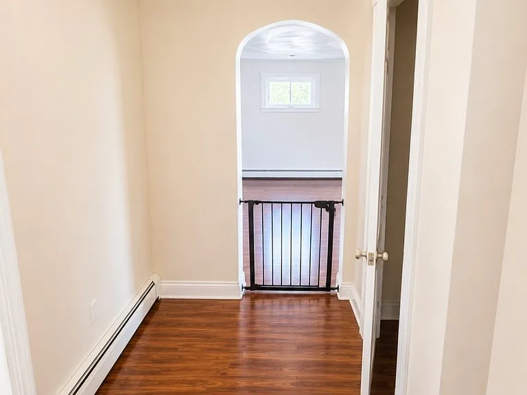 1st floor hallway to living room - digitally altered to remove personal belongings