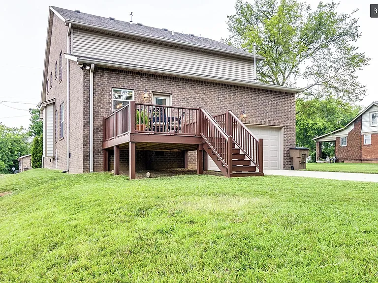 Situated on a corner lot with deck, private driveway and 2-car attached garage.