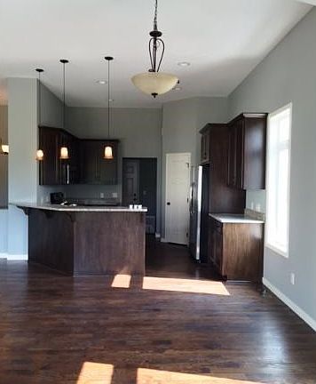 Adjacent dining with hardwood floors