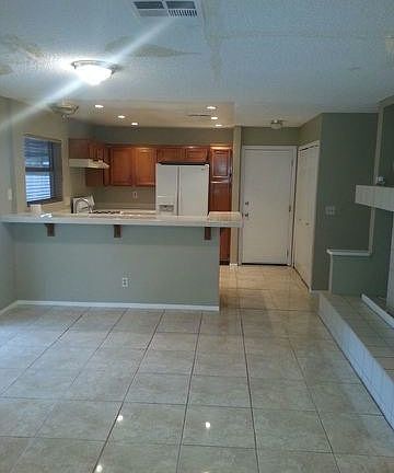 dining area looking into kitchen with breakfast bar