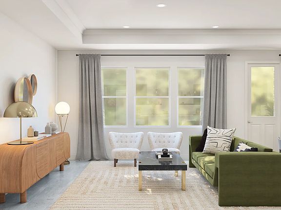 Great room with tray ceiling and crown moulding