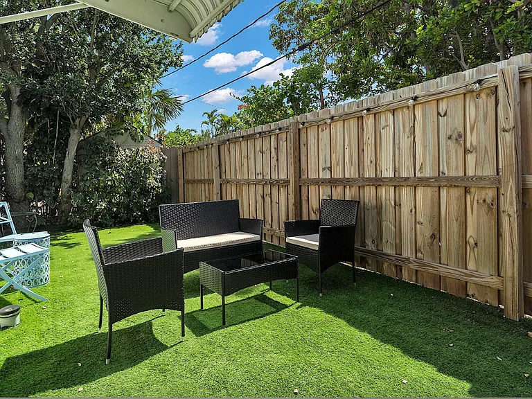 Front private yard. Fully fenced in, secure and well lit in the evening. Great for dogs, kids, dining etc.
