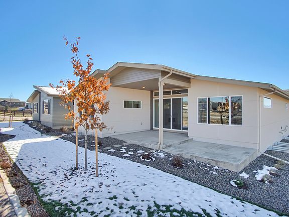 Exterior Rear Photo representing home to be built and may demonstrate optional features