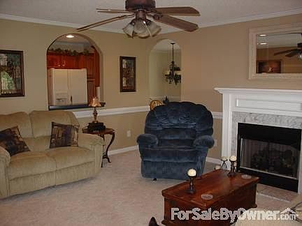 Living Room
						:
						Windor shows opening to kitchen and doorway to dining room. Recessed lights/CF